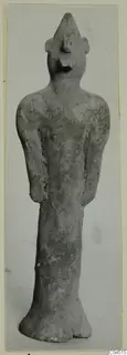 Terracotta standing figurine with a pointed head-top and flared base, from Ayia Irini