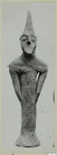 Terracotta Minor Plastic 3: standing terracotta figurine with a tall pointed head and flared base