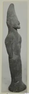 Terracotta figurine of a standing human figure with a tall pointed head, from Ayia Irini