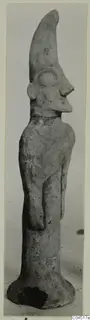 Terracotta figurine with a tall curved crest and flared base, from Ayia Irini