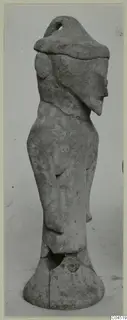 Terracotta figurine of a standing figure with a tall cap-like headdress, from Ayia Irini