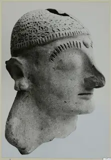 Terracotta head of a figure from Ayia Irini, shown in profile against a plain background