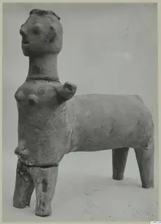 Terracotta figurine from Ayia Irini with a human-like head and breasts on a four-legged, animal-like body