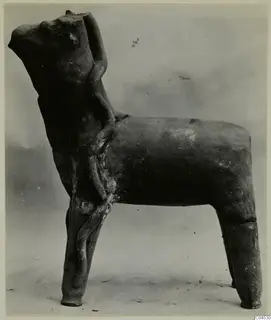 Terracotta statuette of a four-legged animal with a tubular form applied along its side, from Ayia Irini