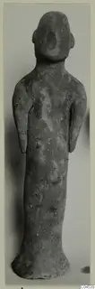 Terracotta figurine of a standing figure with arms at its sides