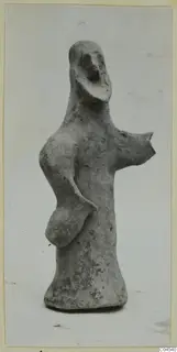 Terracotta figurine of a standing figure with one arm stretched out to the side, from Ayia Irini