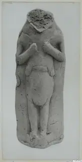 Terracotta figurine of a standing figure with its head broken off and hands raised to the chest