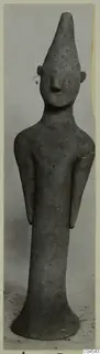 Terracotta figurine from Ayia Irini: a standing human figure with a tall pointed head and long body