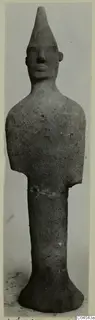 Terracotta figurine of a standing figure with a tall conical head and broken-off arms, from Ayia Irini