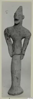 Terracotta figurine of a standing human figure with arms bent at the waist, from Ayia Irini