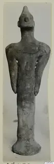 Terracotta figurine of a standing figure from Ayia Irini, seen from the front.