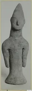 Terracotta standing figurine with a tall pointed head and short arms, from Ayia Irini