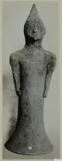 Terracotta figurine of a standing human figure with a tall pointed head and a flared base