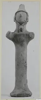 Terracotta figurine with a long cylindrical body, short projecting arms and a conical head, from Ayia Irini