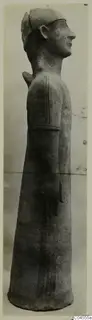 Terracotta Proto-Cypriote II, a tall standing figure seen in profile facing right