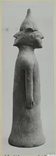 Terracotta Minor Plastic 2: standing terracotta figurine with a conical cap and two profile faces, on a flared base