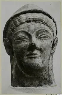 Head sculpture from Mersinaki with a close-fitting cap, wide ears, narrow eyes and a closed mouth