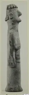 Terracotta figurine of a standing figure with a bent arm and a tall cylindrical base, seen in side profile.