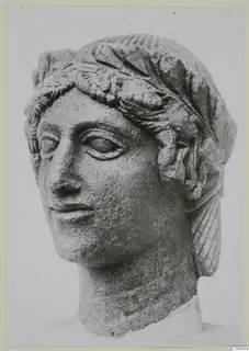 Limestone head from Arsos with a leafy band across the forehead and hair drawn back from the face