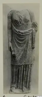 Stone statue of a standing draped figure, headless, from Arsos