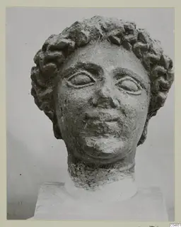 Stone statue head with curled hair, Arsos VIII-IX