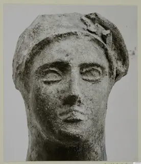 Limestone head from Mersinaki with a close view of the face and headdress