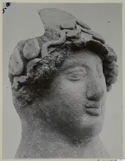 Head of a sculpture from Mersinaki, with a wreath-like headdress of rounded forms and a broken top