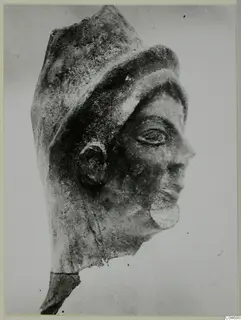 Head of a sculpture in profile, with a tall headdress and a curled beard, from Mersinaki