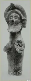 Terracotta figurine of an upright figure with a tall headdress, a broad face and a disc-shaped element on the chest