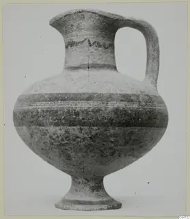 Pottery White Painted I-II jug from Amathus with a wavy painted band on the neck and a single strap handle