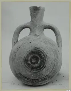 Pottery White Painted II vessel with two loop handles and dark concentric circles painted on the body