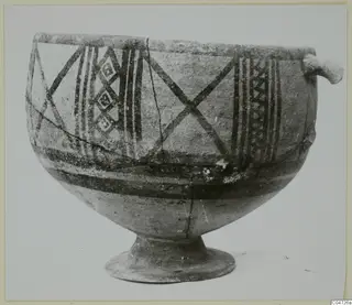 Pottery White Painted II bowl from Amathus, with dark painted bands and a small side handle