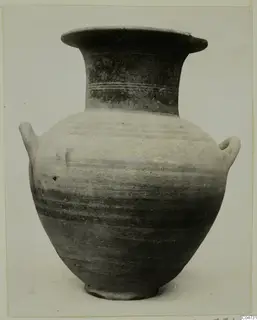 Pottery White Painted II jar from Amathus with a flared rim, two handles and a banded neck