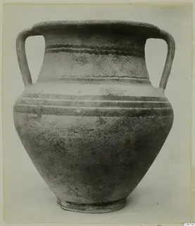 Two-handled White Painted II pottery vessel with dark painted bands and a wavy band on the neck