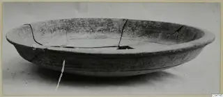 Pottery Bichrome IV plate, a shallow cracked vessel with a wide rim, photographed on a plain background