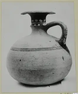 Pottery Bichrome IV jug from Amathus with flaring rim, single loop handle and dark painted bands