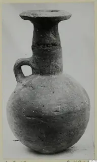 Pottery jug with a globular body, flared rim and single loop handle, from Amathus tombs