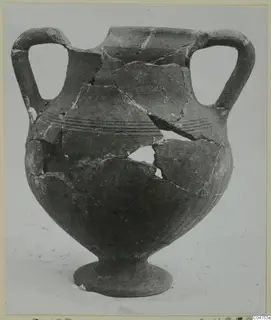Two-handled Black Slip jar from Amathus, broken and partly reassembled, with grooved bands around its shoulder