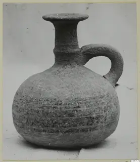Single-handled jug with a round body, flared mouth and dark horizontal bands, from Amathus