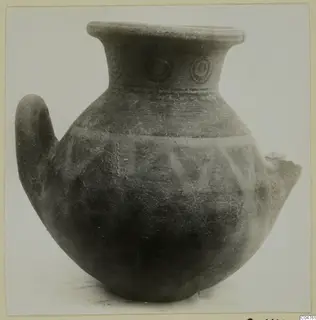 Pottery jug from Amathus with a single loop handle, concentric circle motifs on the neck and triangular bands on the body