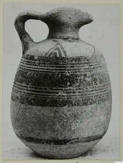 Pottery Bichrome III jug from Amathus with a strap handle and painted bands on the upper body