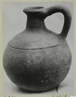 Jug, Pottery Plain White IV-V, from Amathus, with a tall neck, one strap handle and incised lines on the shoulder.