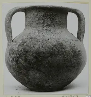 Plain white two-handled jar from Amathus with a globular body and short neck