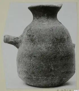 Round-bodied pottery vessel with a flared neck and a short horizontal lug handle on one side.