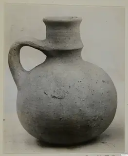 Pottery jug with a single loop handle and a tall flaring neck, from Amathus