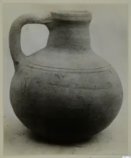 Single-handled jug with a rounded body and two incised lines around the shoulder, from the Amathus finds