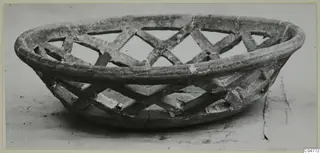 Shallow openwork bowl from Amathus with a lattice of crossed bands, seen from the side