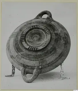 Pottery Bichrome III vessel from Amathus, decorated with concentric circles and hatched bands.