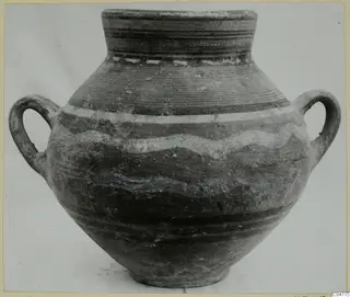 Two-handled pottery vessel with a narrow neck and pale and dark bands, shown against a plain background
