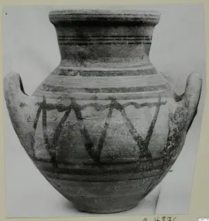 Two-handled jar from Amathus, Pottery Bichrome V, with dark painted bands and vertical strokes on the body